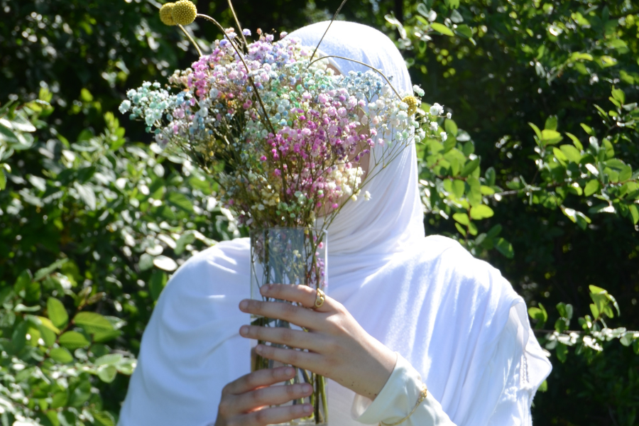 flower veiling face, grove background