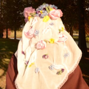 floral headpiece, sheer cotton veil, variety of colorful flowers, lace trim, forest background, warm lighting