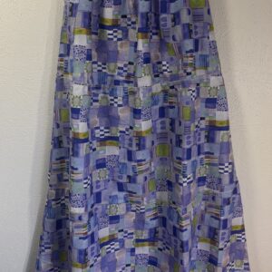 patchwork print skirt, front view, blue, various blue toned prints, three tiers, visible serged finish, side pocket
